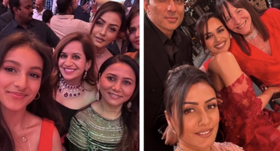 Namrata Shirodkar and Sitara in coordinated Indian wear, smiling at the judges' panel, with the glittering Miss World stage in the background.